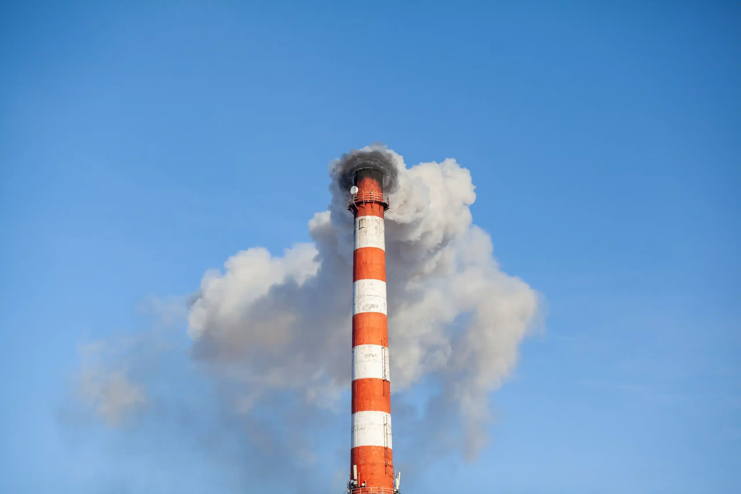 white-thick-smoke-from-the-boiler-room-chimney-in-2023-11-27-05-34-23-utc-scaled-1.webp