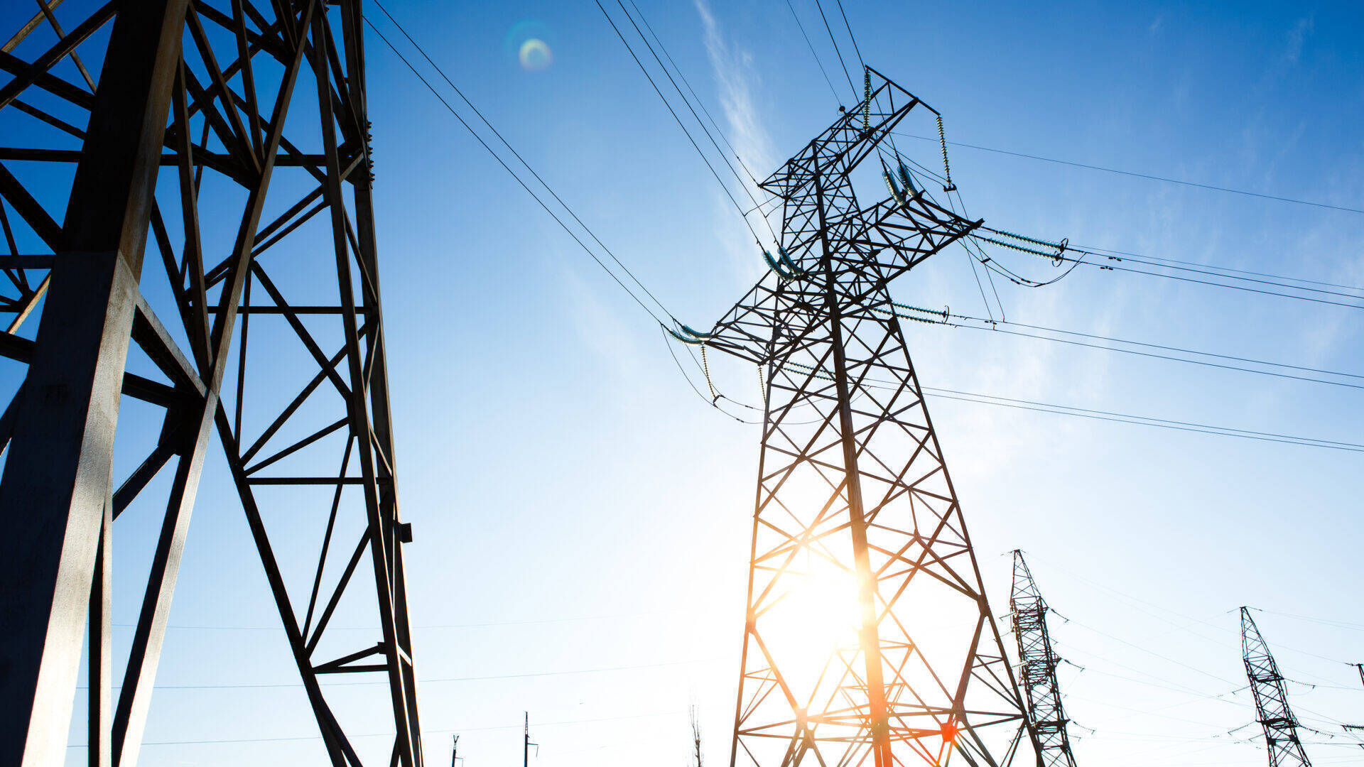 high-voltage-power-lines-against-a-blue-sky-2026-03-10-02-08-14-utc.jpg